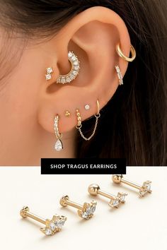 three pairs of ear piercings with crystal stones