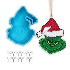 an ornament and cookie cutters are shown with the grin face on it