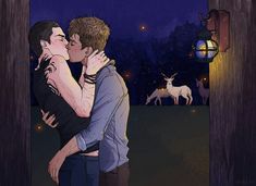 two people kissing each other in front of some deer at night with the lights on