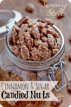 cinnamon and sugar candied nuts in a glass jar on a wooden table with text overlay