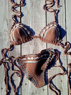 © Copyright protected Original design by GoodMoodCreations Handmade with 100% high-quality cotton yarnembellished with sea shells  You can get wet with this bikini and it will stay in place. The stitches are very dense and tight to give enough support and coverage. SIZING: If you are not sure which size to choose for the top: (XS, S, M, L, or, XL): US/UK sizes:                                             XS 32AA - 32A                              S 32B - 32C - 34A - 34B - 36A Brown Beachy Swimwear For Beach Season, Handmade Beachy Swimwear For Beach Season, Bohemian Brown Swimwear For The Beach, Festival Brown Triangle Top Swimwear, Handmade Triangle Top Swimwear For Beach, Dark Tan, Crochet Bikini, Women Swimsuits, Sea Shells