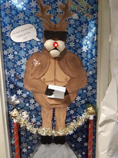 a door decorated to look like a man with reindeer antlers on his head and glasses