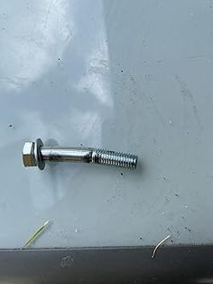 a screw is attached to the side of a vehicle