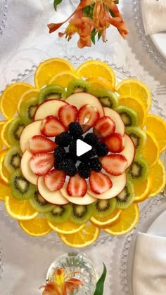 an arrangement of fruit is arranged in the shape of a flower