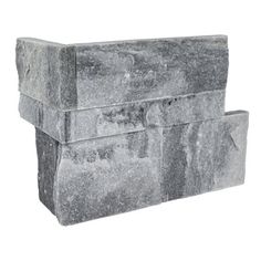 two stone blocks are stacked on top of each other