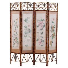 a room divider made out of bamboo with flowers and leaves painted on the screen