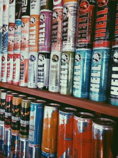 many different types of cans are on the shelves