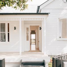 a white house with an open front door