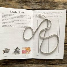 an open book with some type of string attached to it