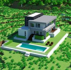 an aerial view of a modern house in the middle of a grassy area with trees and bushes