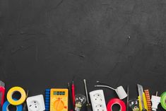 a group of different tools sitting on top of a black table next to each other