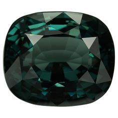 an emerald colored diamond on a white background