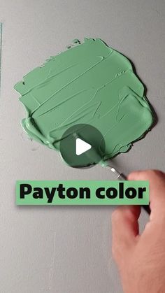 someone is painting the wall with green paint and white lettering that says, payton color