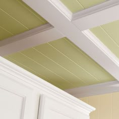 the ceiling in this kitchen is painted green