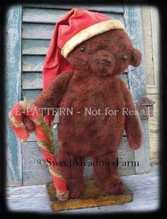 a brown teddy bear wearing a red hat