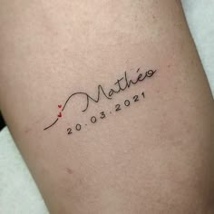 a woman's tattoo with the word mother written in cursive writing on her thigh