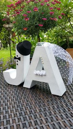 the letters are decorated with black and white accessories