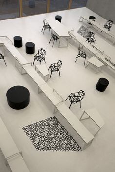 several tables and chairs are arranged on the floor