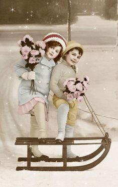 two children are standing on a sled with flowers