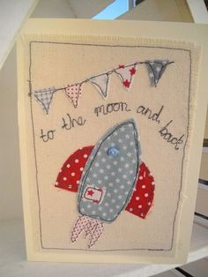 a handmade card with a rocket ship on it and the words to the moon and back