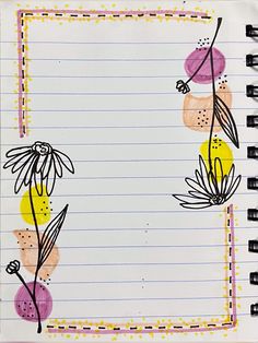 an open notebook with flowers drawn on the cover and lined paper in front of it