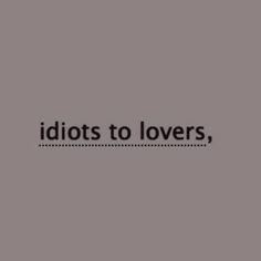 the words idiotots to lovers, are in black and white on a gray background