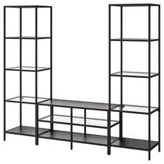 two black shelves with glass shelves on each side and one shelf in the middle, against a white background