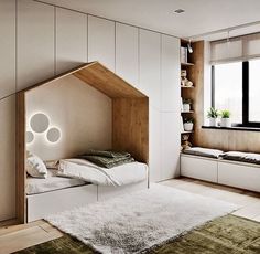 a bedroom with a bed and shelves in the corner next to a window that is open