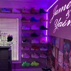 a room with purple lighting and lots of shoes on the shelves in front of it