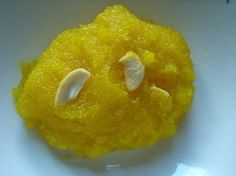 a close up of a yellow dessert on a white plate