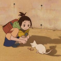 a woman kneeling down next to a white cat and looking at a small kitten on the ground