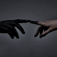 two hands reaching out towards each other