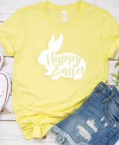 a yellow shirt with the words happy easter printed on it, next to ripped shorts