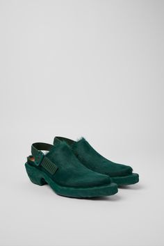 Green long calf hair leather clogs with slingback straps and rubber outsoles (20% natural). Green Formal Shoes, Leather Clogs, Slipper Sandals, Boots And Sneakers, School Shoes