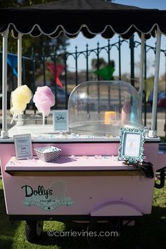 an old fashioned ice cream cart on the grass