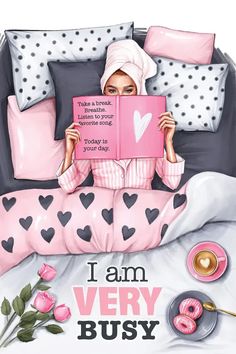 a woman laying in bed reading a book with donuts on the side and pink pillows behind her