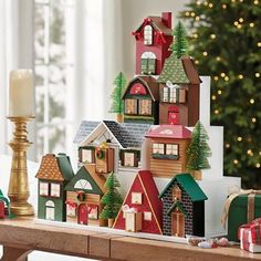 a wooden table topped with lots of christmas decorations