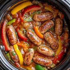 sausages and peppers are cooked in the slow cooker