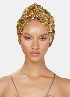 Hand made heavy sequin-embellished turban in gold tones on satin, Incrusted tonal jewels. One Size This is a unique accessory designed by MARYJANE CLAVEROL. Each piece has been carefully hand made with local artisans using the finest materials to become an essential piece in your wardrobe while keeping traditional handcrafting techniques alive. Any variations are due to its small scale manufacturing. Traditional Gold Turban Headband, Traditional Gold Headband Turban, Traditional Headwrap For Party, Traditional Party Headwrap Headband, Traditional Party Headwrap, Gold Embellished Headpieces For Wedding, Gold Turban Headband For Party, Gold Turban Style Headband For Party, Embellished Headpieces For Evening