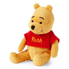 a winnie the pooh stuffed animal with a red shirt