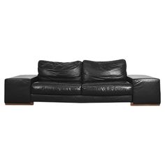 This stunning sofa was manufactured in Italy by Natuzzi, a small workshop founded in 1959 in Puglia, which grown to become a worldwide manufacturer. This in-line model was designed by Natuzzi Design Center, a team of architects, interior designers and colorists work on developing the individual models, the different settings and spaces, and the combinations of design, function, materials and colors. This sofa was finished in the highest quality precious black leather and features two add wide mo Natuzzi Sofa Bed, Low Leather Sofa, Black Leather Sofa Living Room, Velvet Lounge Chair, Black Leather Sofas, Black Tears, Italian Sofa, Design Center, Vintage Sofa