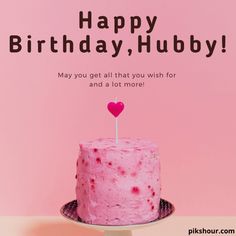 a pink birthday cake with a heart on top and the words happy birthday, hubby