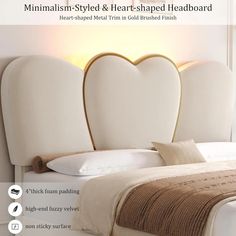 a white bed with two heart shaped headboards on it's sides and the words, minimalism - styled & heart - shaped headboard