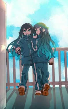 two people standing on a balcony with their arms around each other and looking at the sky