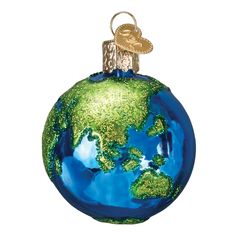 an ornament shaped like the earth with green and blue glitters on it