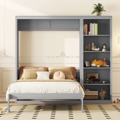 a bed sitting under a book shelf next to a white wall