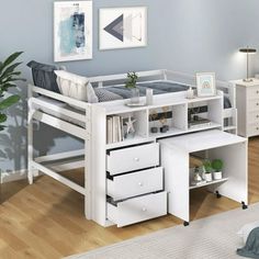 a white loft bed with drawers underneath it and a desk in front of the bed