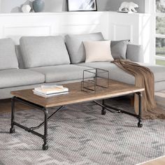 a living room with a gray couch and coffee table