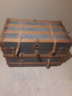 an old trunk is sitting on the floor