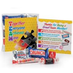 a puzzle piece, candy bar wrapper and greeting card